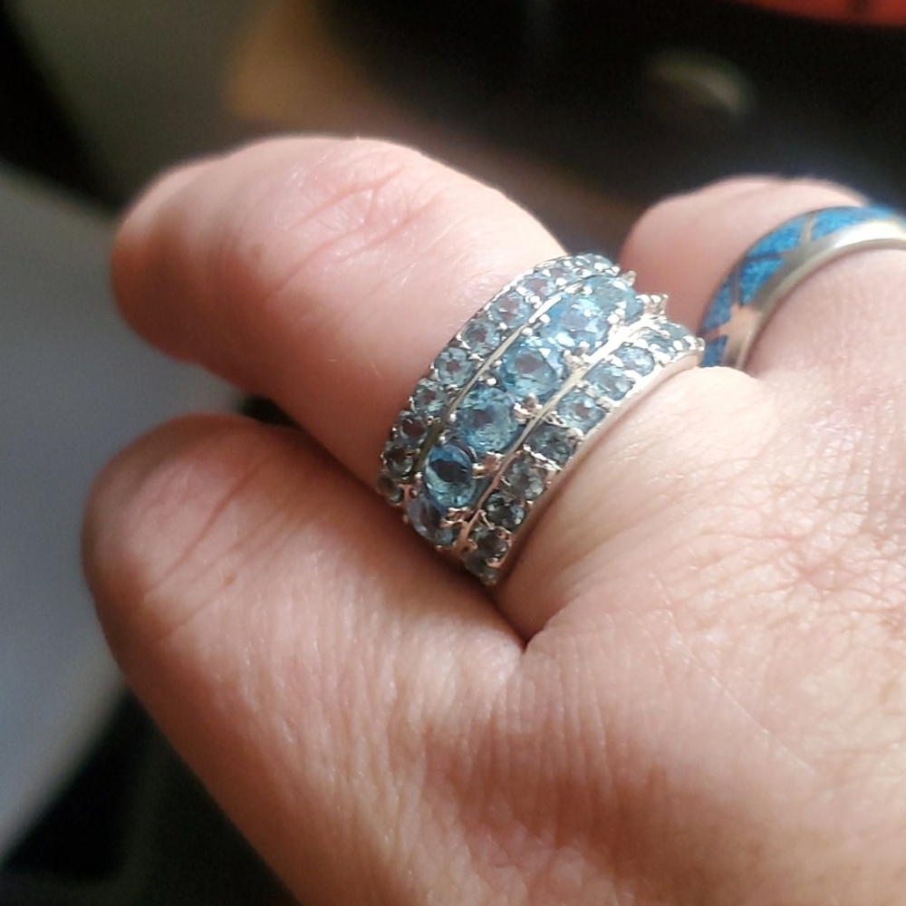 Ice blue topaz ring. adjustable . Sterling silver.